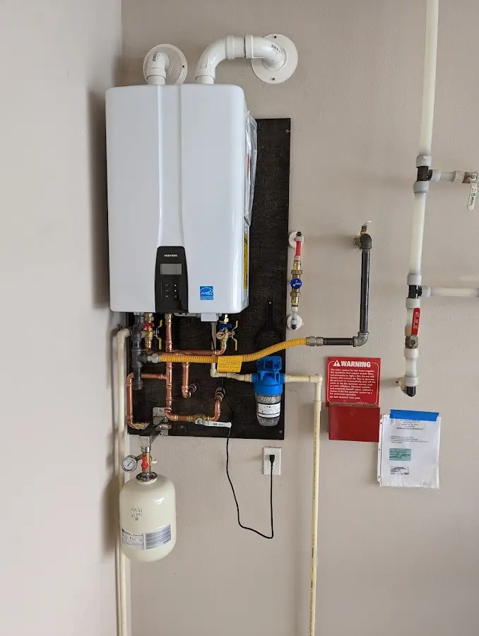 Professional plumber installing copper piping in a Sulphur home